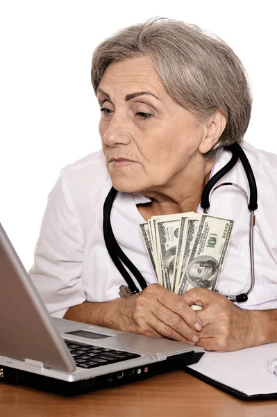 Confident Female Doctor Sitting Table Dollars — Stock Photo, Image