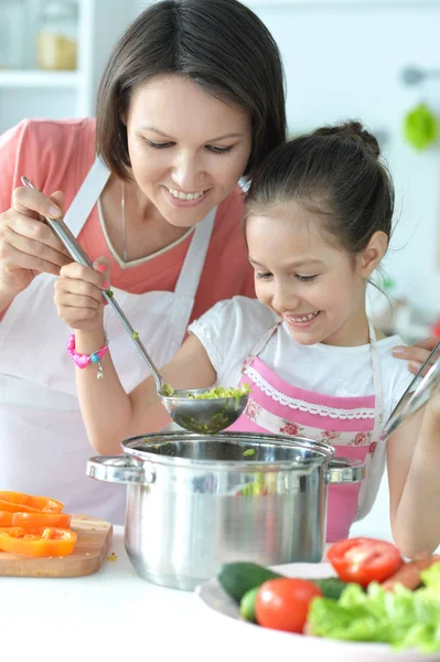 Cute Little Girl Her Mother Cooking Soup Together Kitchen Table — Stock Photo, Image