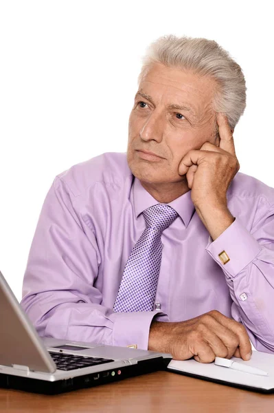 Elderly businessman with laptop — Stock Photo, Image