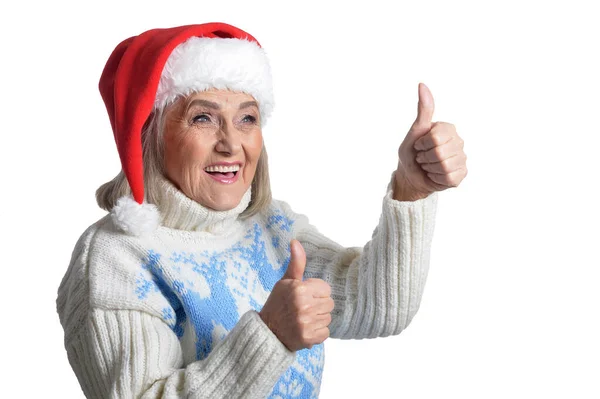 Portret Senior Kobiety Santa Hat Pokazuje Kciuk Górę Białym Tle — Zdjęcie stockowe