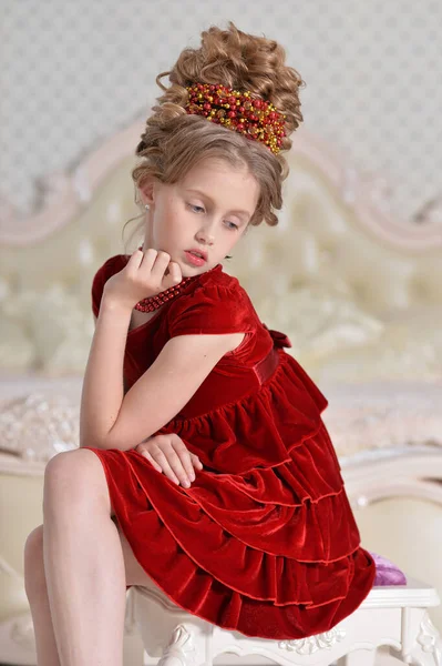 Cute Little Girl Red Dress Sitting Bedroom — Stock Photo, Image