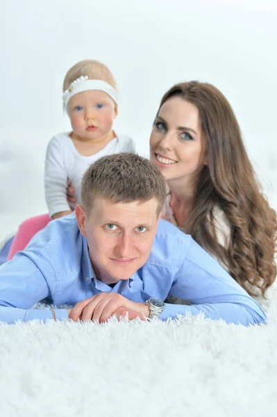 Happy parents playing with daughter — Stock Photo, Image