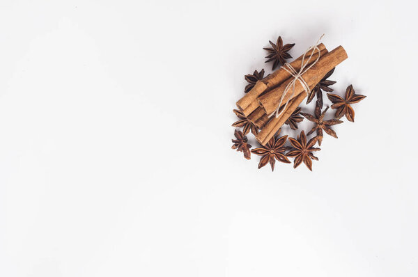 cinnamon stick and star anise on a white background