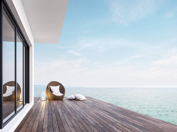 Minimal style room terrace with sea view 3d render,There has dark wooden floors,decorated with rattan furniture and white lantern ,overlooking the sea and sky.
