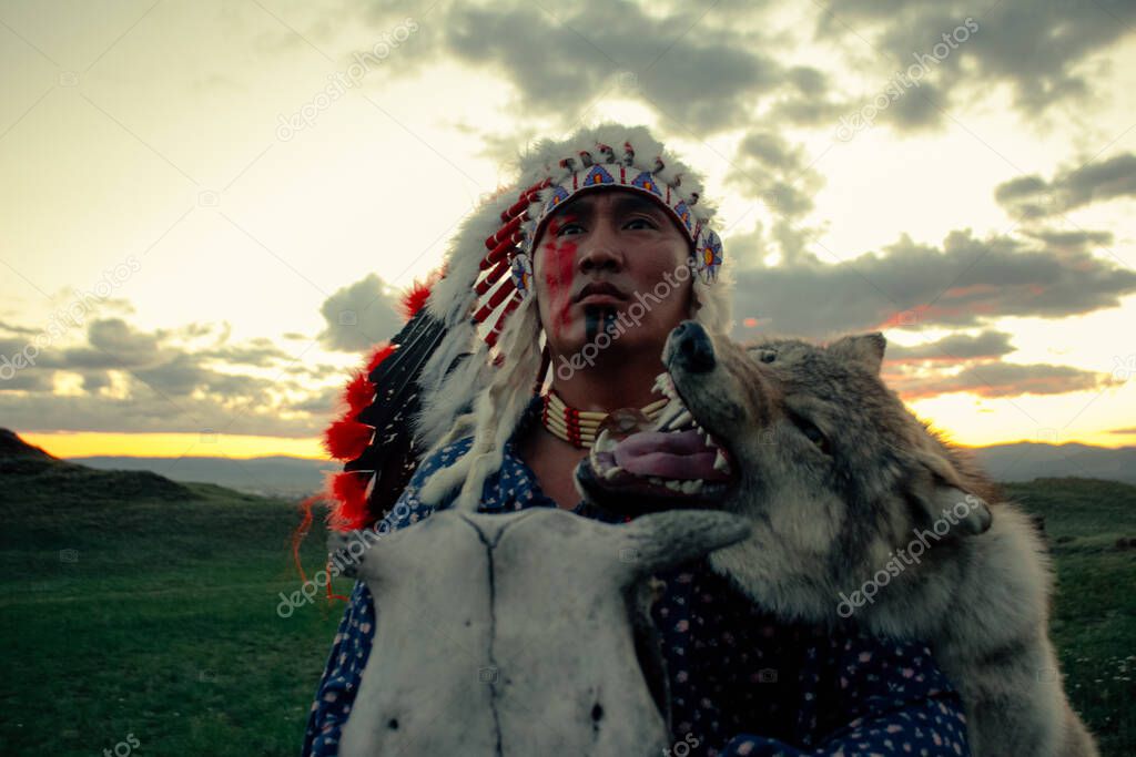 Native American man at sunset outdoor in the steppe