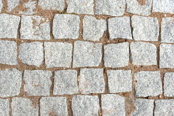 Pavers leather square stones between which sand