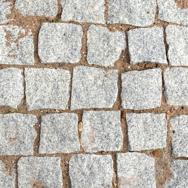 Pavers leather square stones between which sand