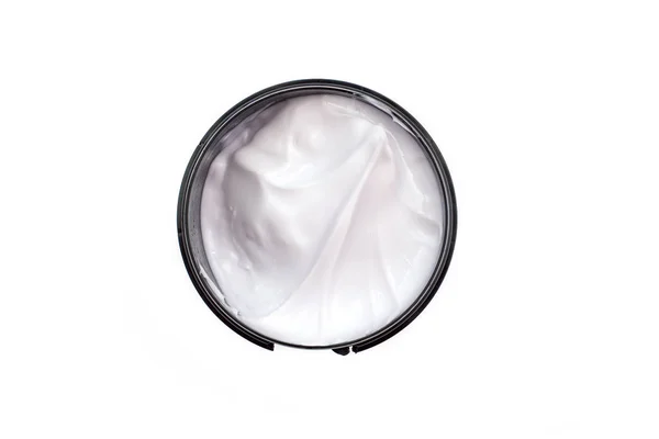 Cuerpo blanco y crema facial en paquete redondo, vista superior, aislado en blanco — Foto de Stock