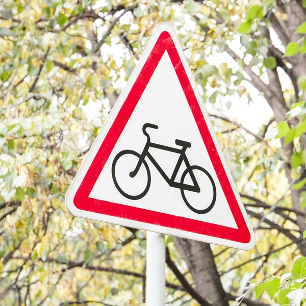 Road sign which shows the bike. The sign stands