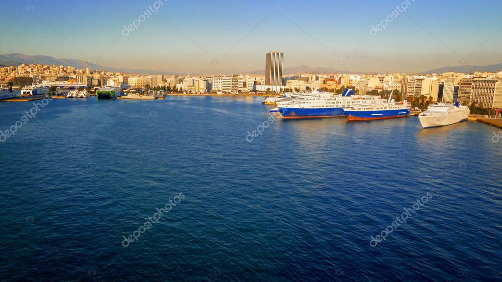 Port of Piraeus in Athens, Greece is the largest Greek seaport, ship logos removed or blurred for commercial use