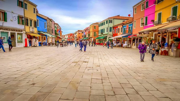 Tourists Visiting the Colorful Fishing Village of Burano - Venice, Italy Stock Photo