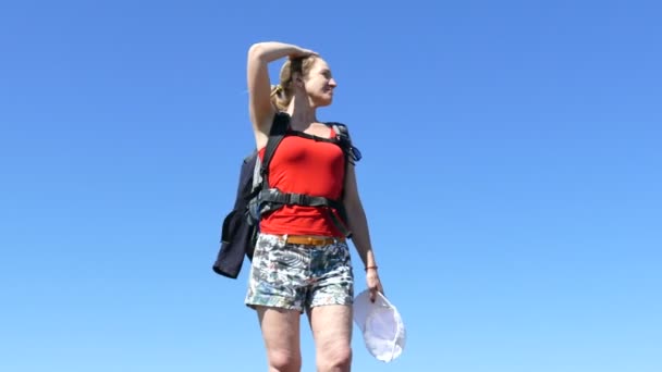 Slender Girl Traveler Backpack Stand Blue Sky Puts Cap — Stock Video