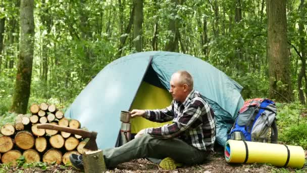 Adult Man Tourist Have Rest Tent Wood Drink Tea Coffee — Stock Video