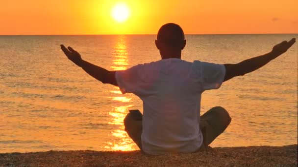 Man Meditates Sunset Sunrise Sea Ocean Raise Hands — Stock Video