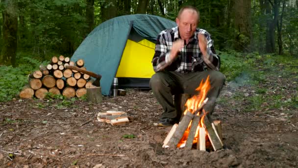 Adult Man Tourist Outdoors Tent Heats Hands Fire — Stock Video