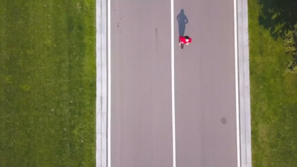Aerial Woman Runner Run Empty Road Top View — Stock Video