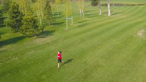 Healthy Aerial Woman Fitness Runner Red Slowly Run Green Field — Stock Video