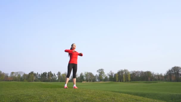 Slow Motion Fitness Woman Sports Exercises Body Warm Green Field — Stock Video