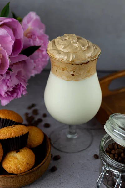 stock image Milk shake. Chocolate and coffee sweet chilled ice-cream drink. Summer drink on the table in a glass goblet on a leg. Bar drinks. Dalgona coffee.