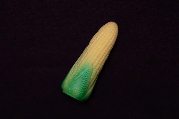 Corn Cob Dark Background Plastic Toy — Stock Photo, Image