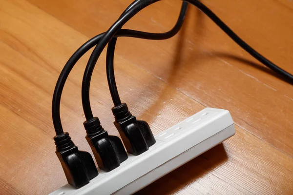 electrical plugs connected to a power strip