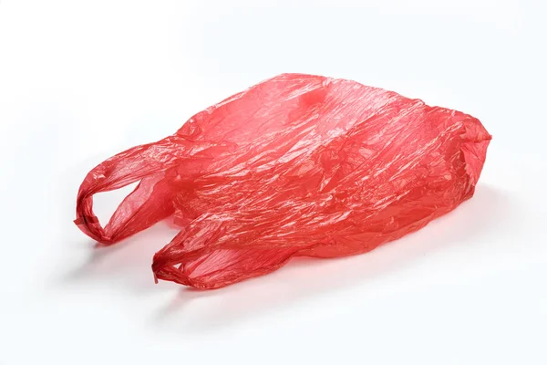 Saco Plástico Vermelho Fechar Com Fundo Branco — Fotografia de Stock