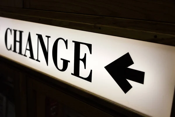 sign of word change and direction arrow