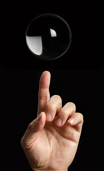 Finger Pointing Transparent Crystal Ball Black Background — Stock Photo, Image