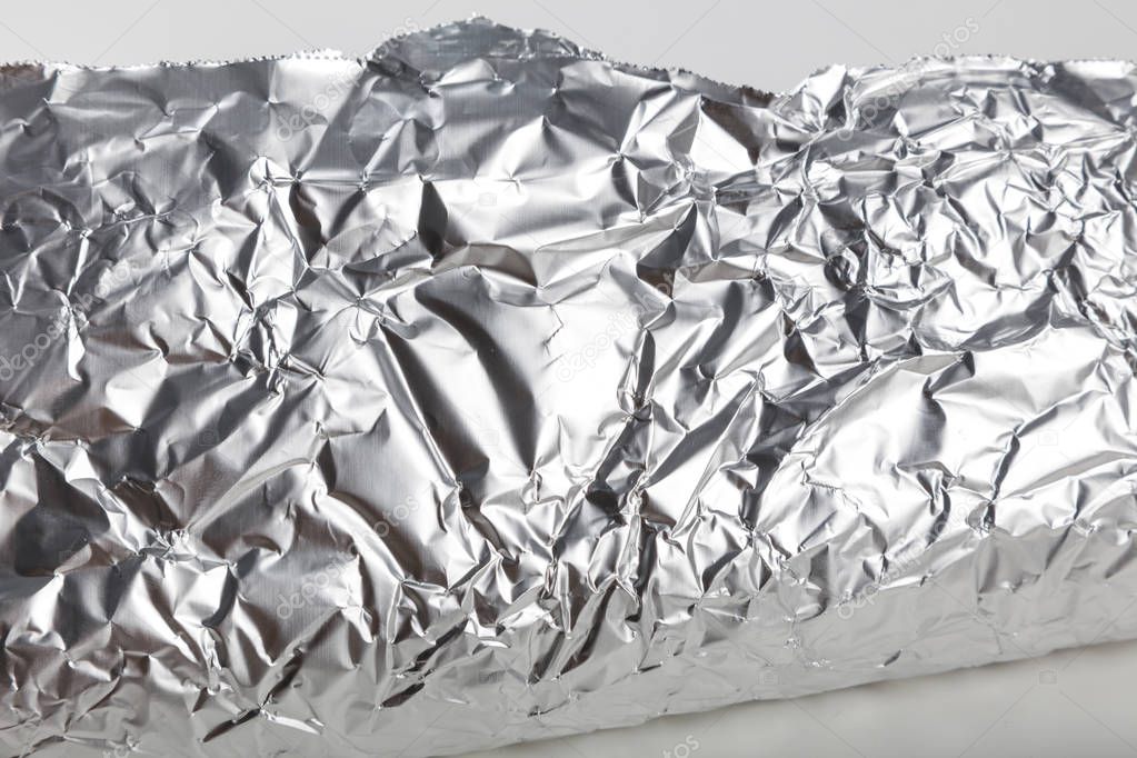 Aluminum foil roll for background, close up.