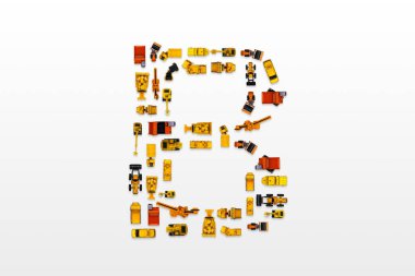 English letters formed by arrangement of Car toy diecast on the white background , Top view . clipart