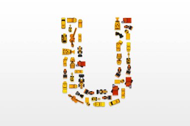 English letters formed by arrangement of Car toy diecast on the white background , Top view . clipart