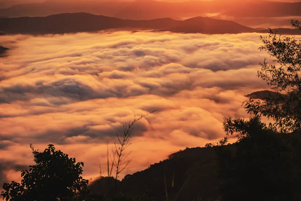 sunset overlooking mountains with Mist .