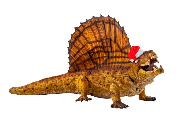 Beyaz arka planda Noel şapkası olan Dimetrodon Dinozoru — Stok fotoğraf