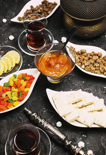 Tea set with lot of sweet colored snacks. — Stock Photo, Image