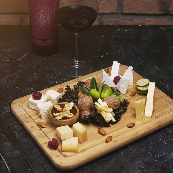 Cheese platter with different cheeses.