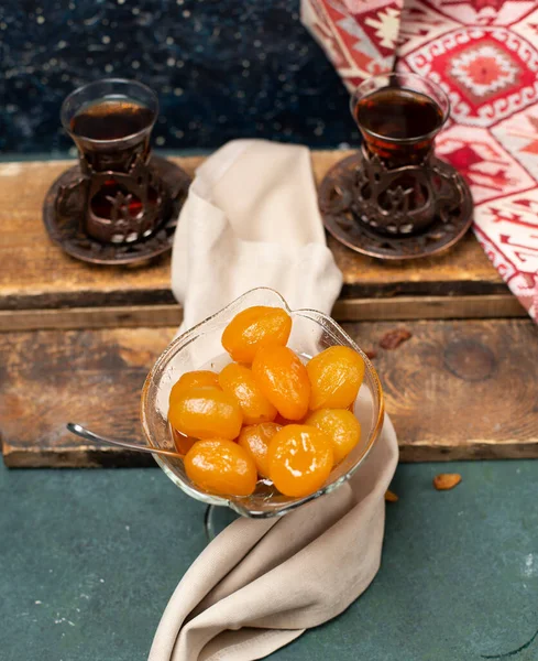 tea and fig jam with wooden background