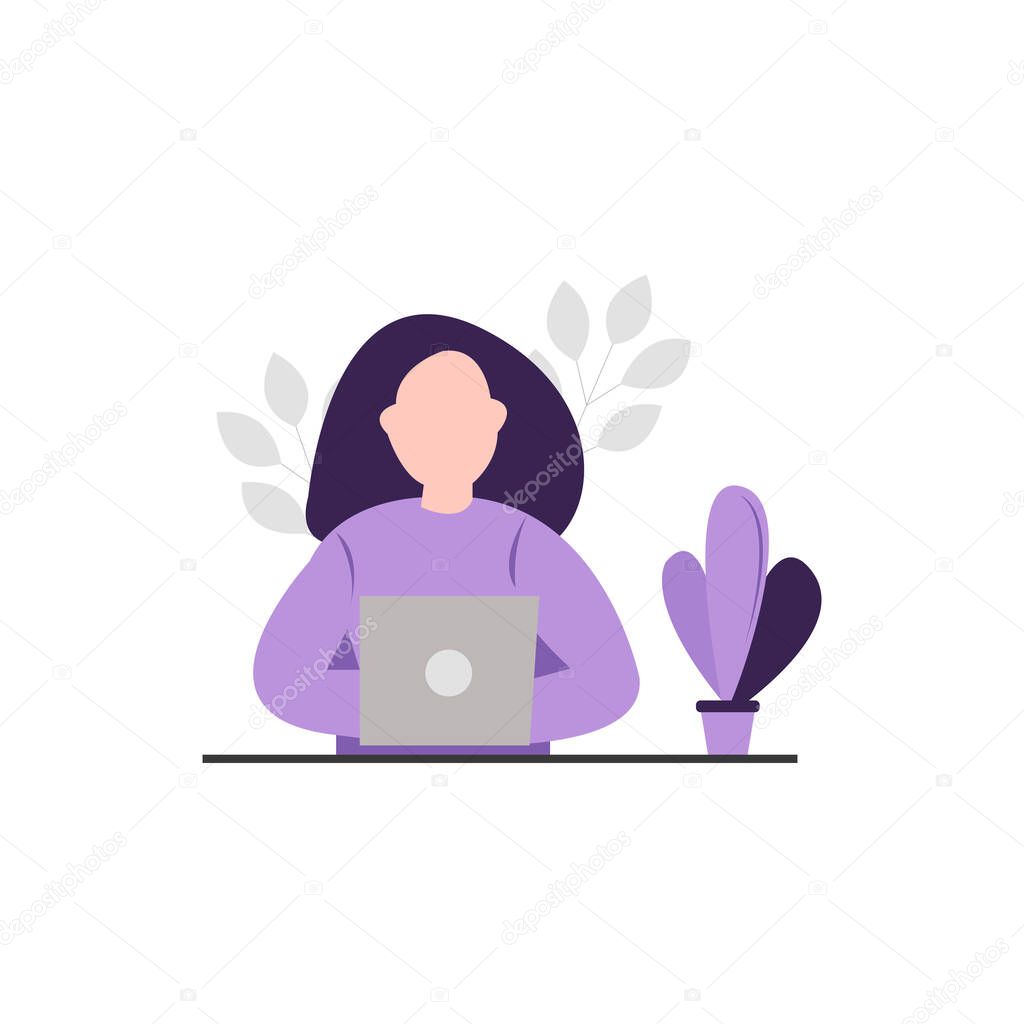 Woman sitting at the desk and working at her laptop