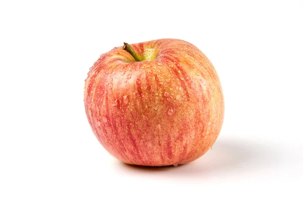 Ein einziger ganzer roter Apfel auf weiß — Stockfoto