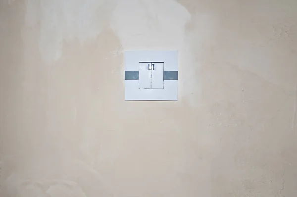 the switch on the wall, repair in the room