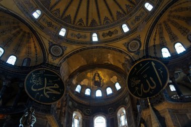 Apse mosaic of the Christianitys Virgin and Child are flanked by roundels with Arabic script bearing the names of Muhammad and Allah. The rondels were added to the basilica when it became a mosque