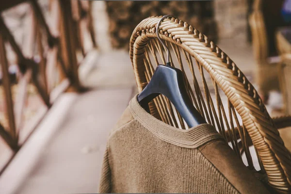 Autumn Story Woolen Knitted Jacket Hangs Hanger Back Wicker Chair — Stock Photo, Image