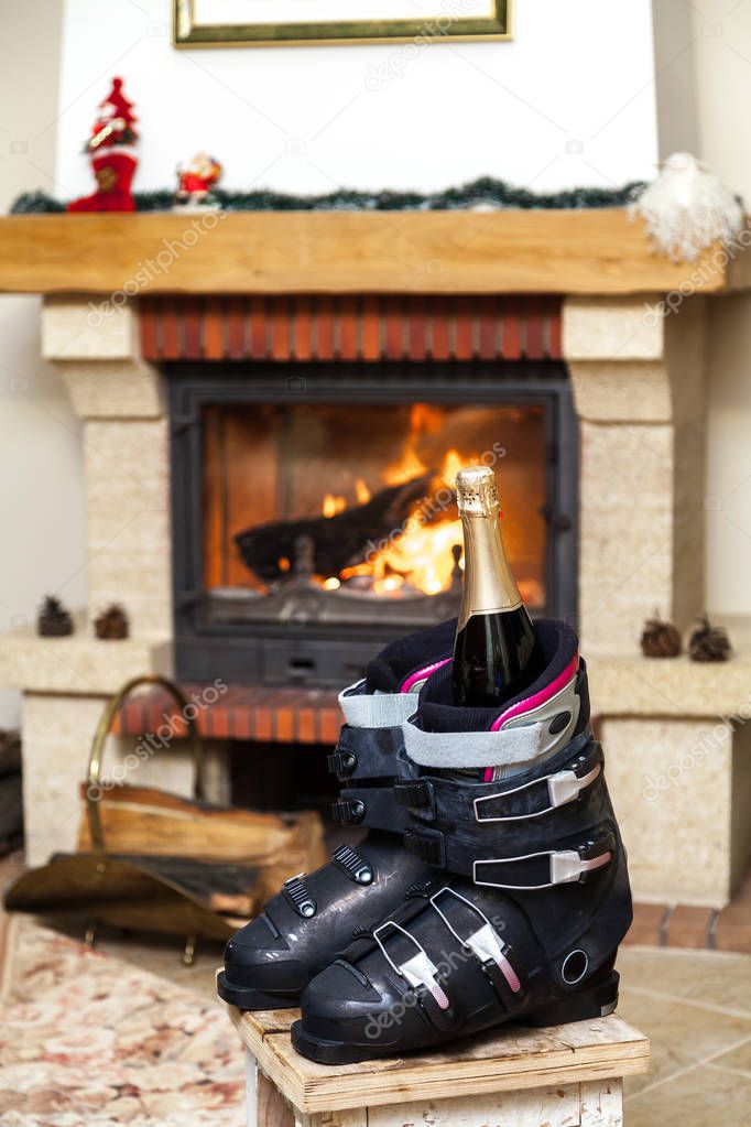 Boots ski boots in front of  fireplace