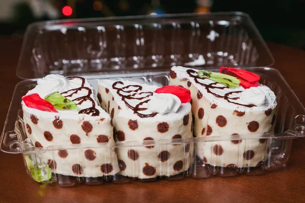 Three delicious drop-shaped cakes in a transparent bo