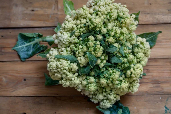 Cauliflower lies on planed boards