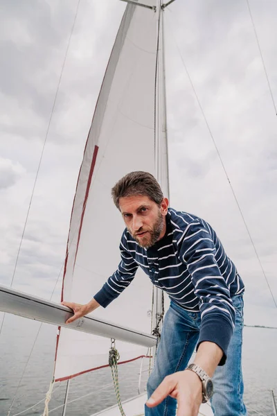 Portrait of  yacht captain against  sail — Stock Photo, Image