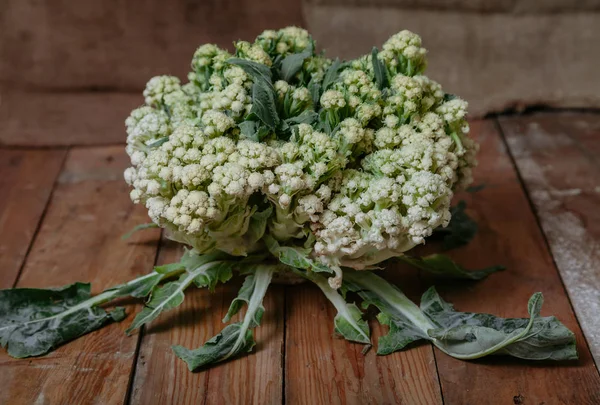 Cauliflower lies on planed boards