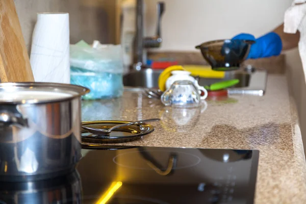 Pot stands on marble surface in kitchen — Stock Photo, Image