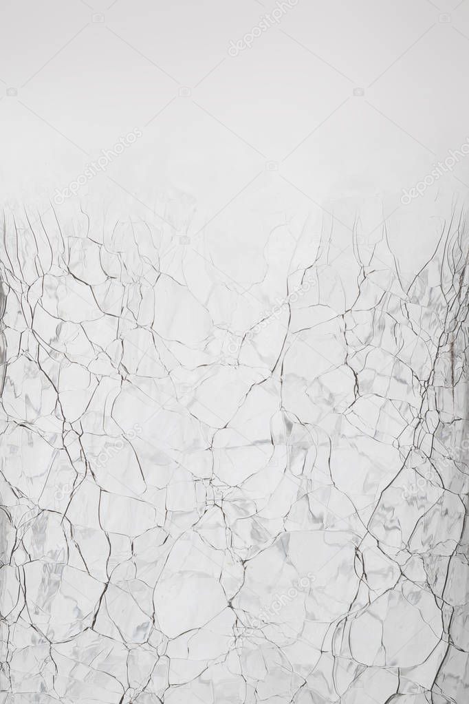 Cracked glass structure on white background