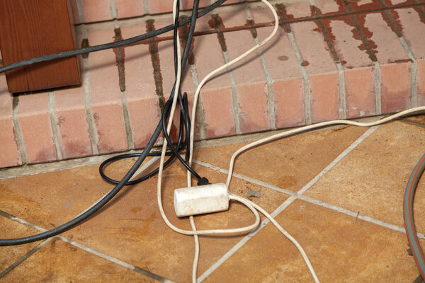 Interweaving of electrical wires lies in front of  step