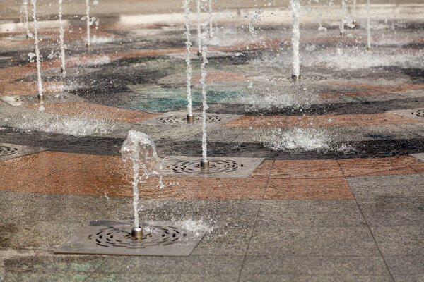 Jets of water and spray of dry fountain close up
